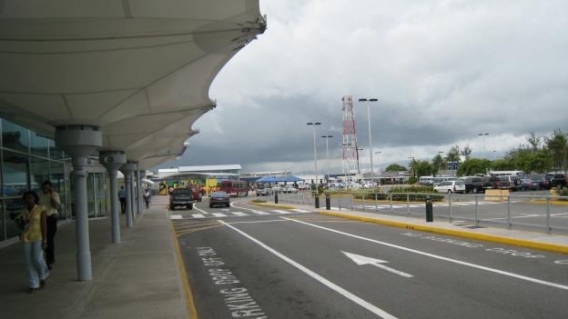 Kingston: KIN (NMIA), Departure area on the left and Airport  Parking on the right